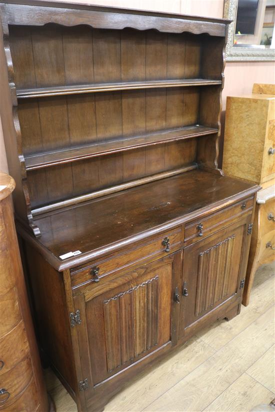 An oak linenfold dresser, W.127cm